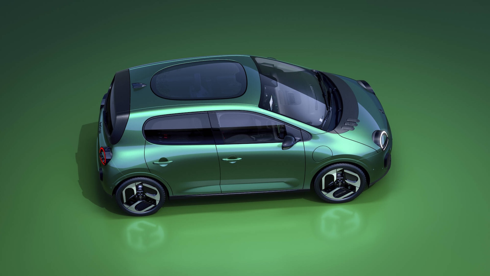 Zielony Fiat 500e E-space w wersji hatchback widziany z góry.